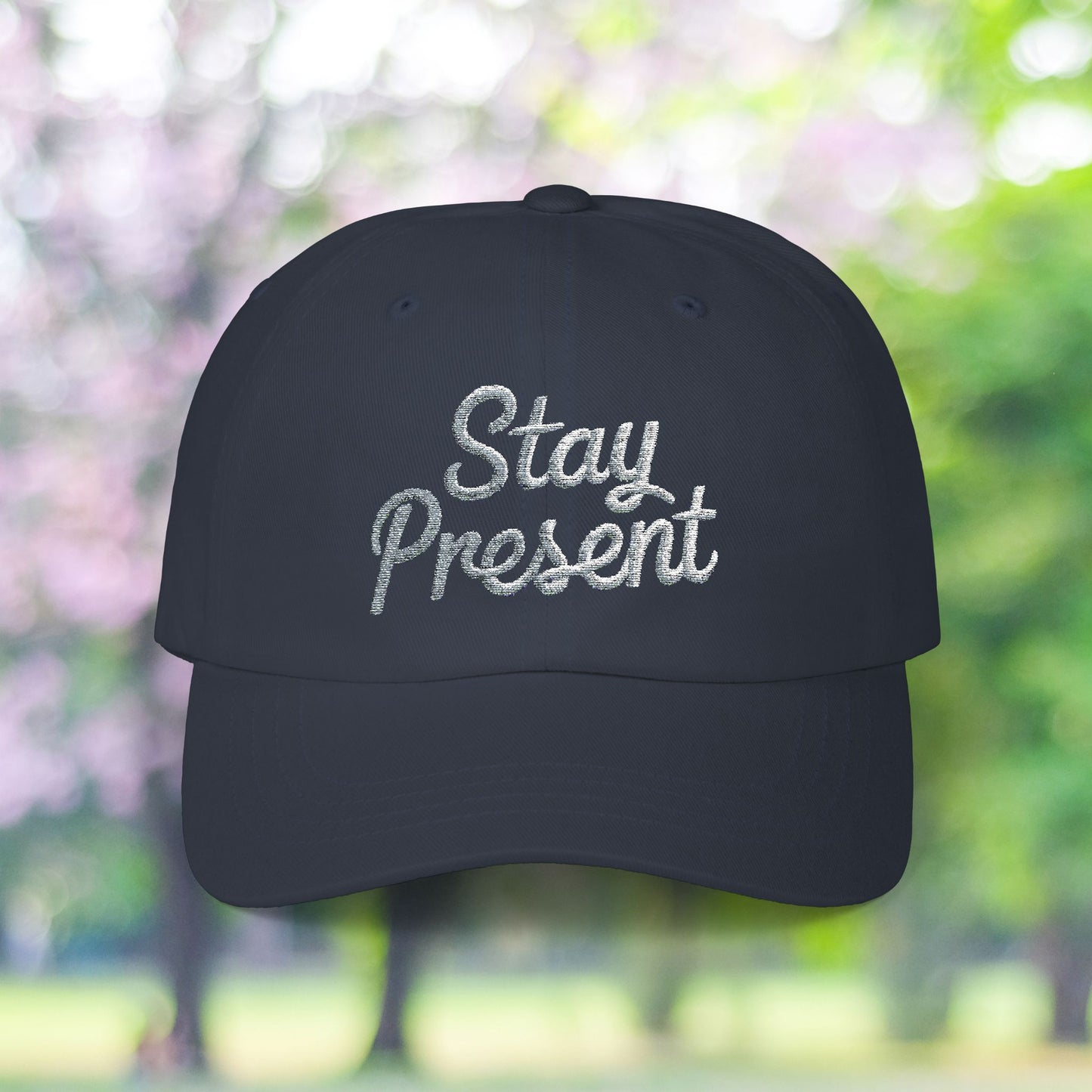 Dark blue baseball cap with Stay Present embroidery, vintage style.