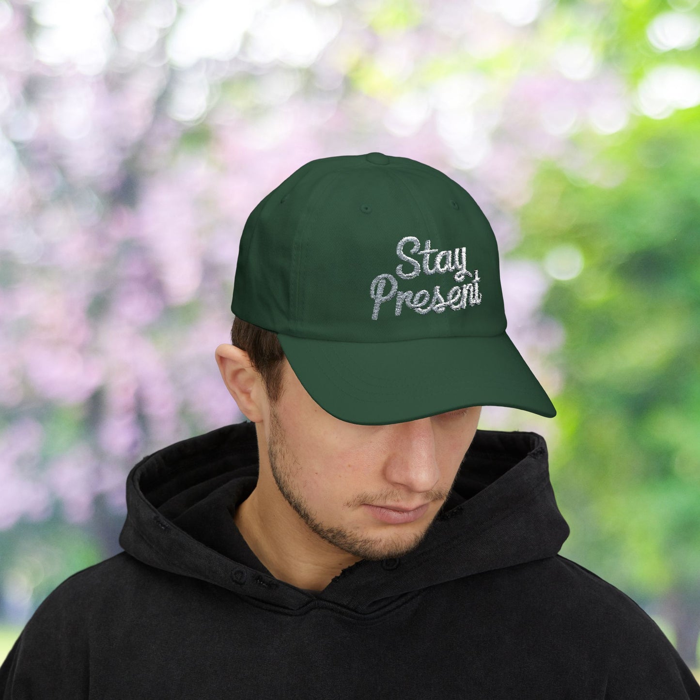 Green Dad Hat with 'Stay Present' embroidery, classic baseball style.