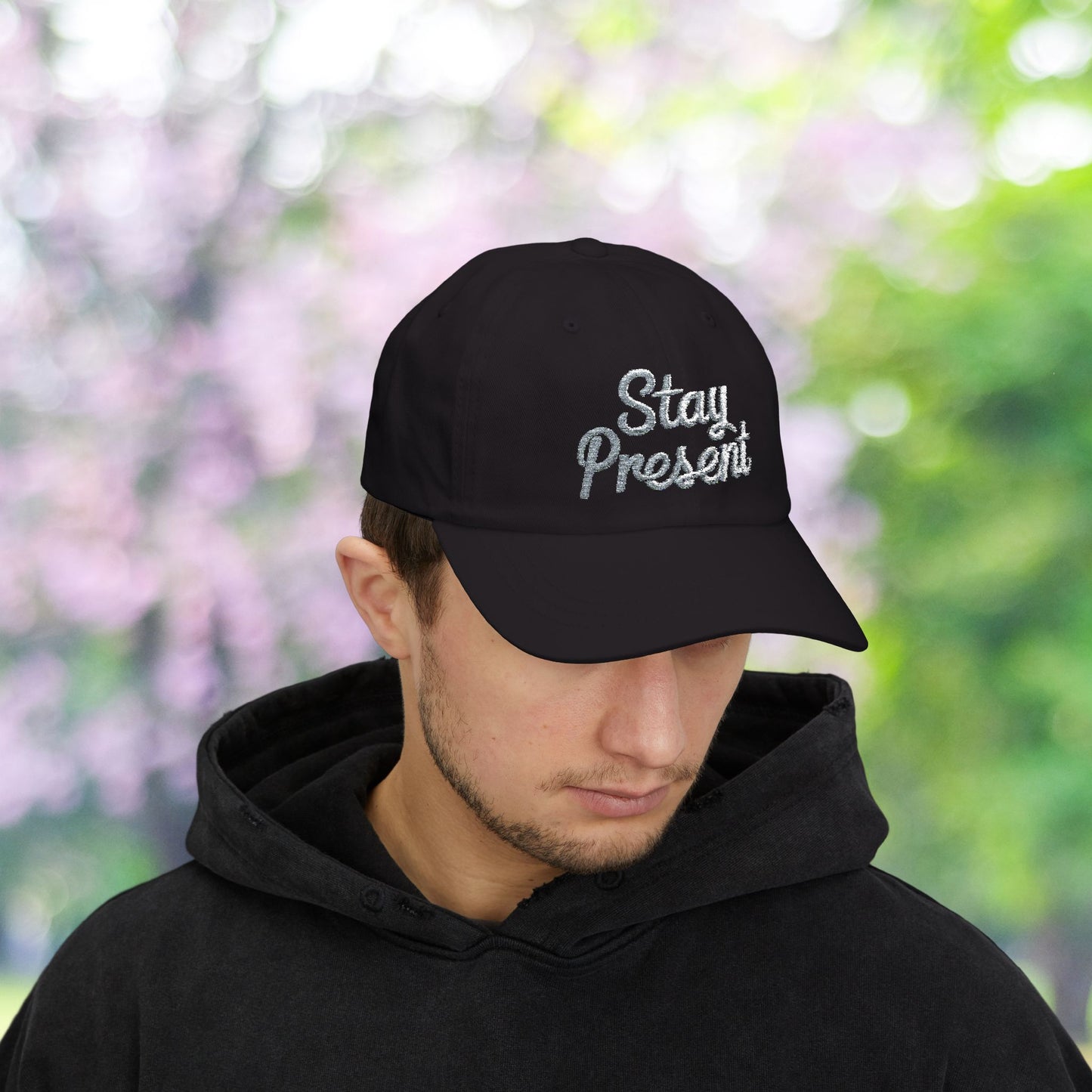 Classic dad hat with 'Stay Present' embroidery.