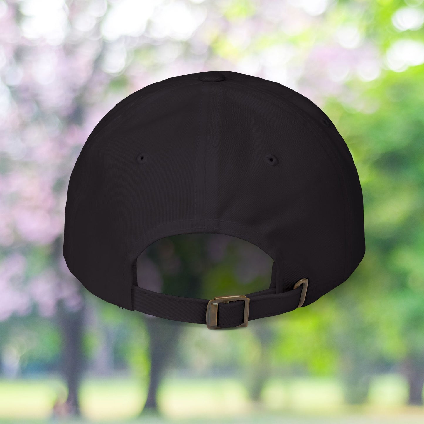Back view of a classic, vintage style baseball hat with metal buckle.