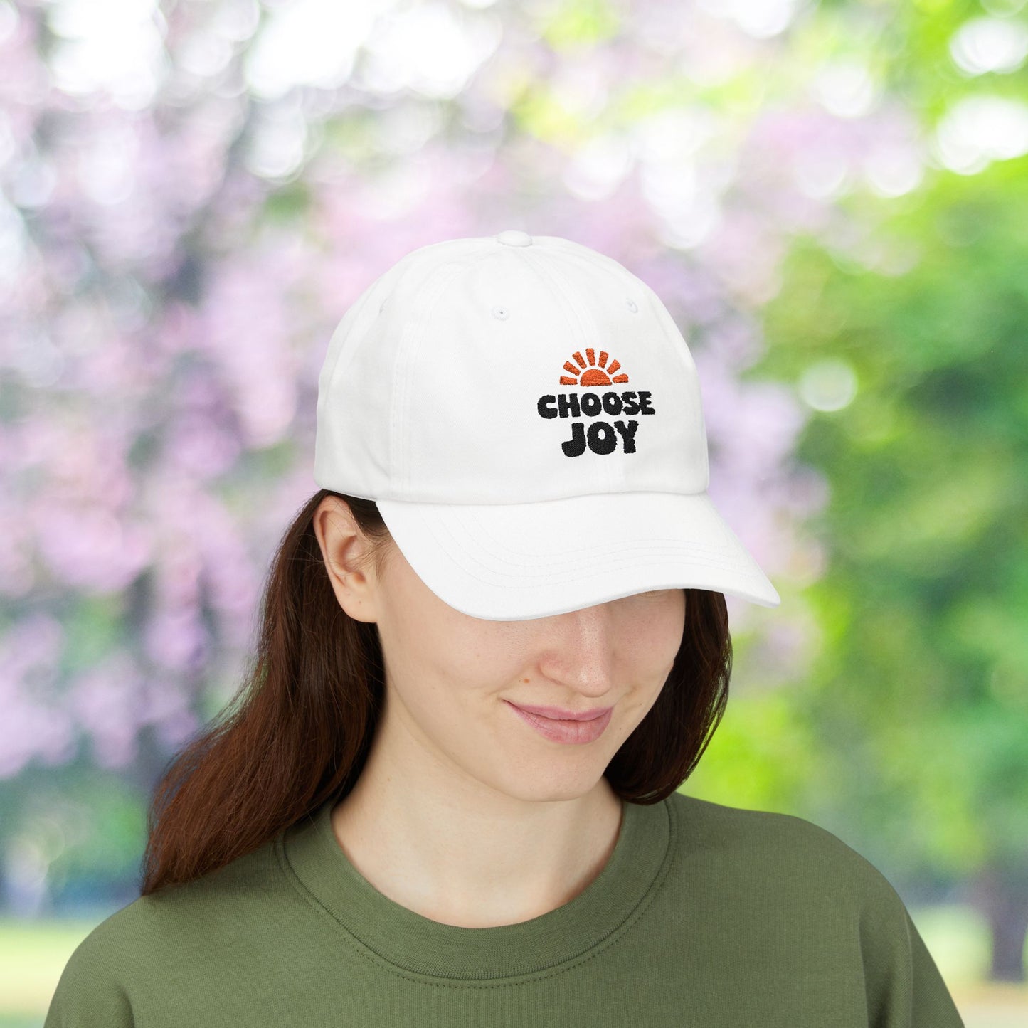 White baseball cap with a "Choose Joy" sun burst graphic.